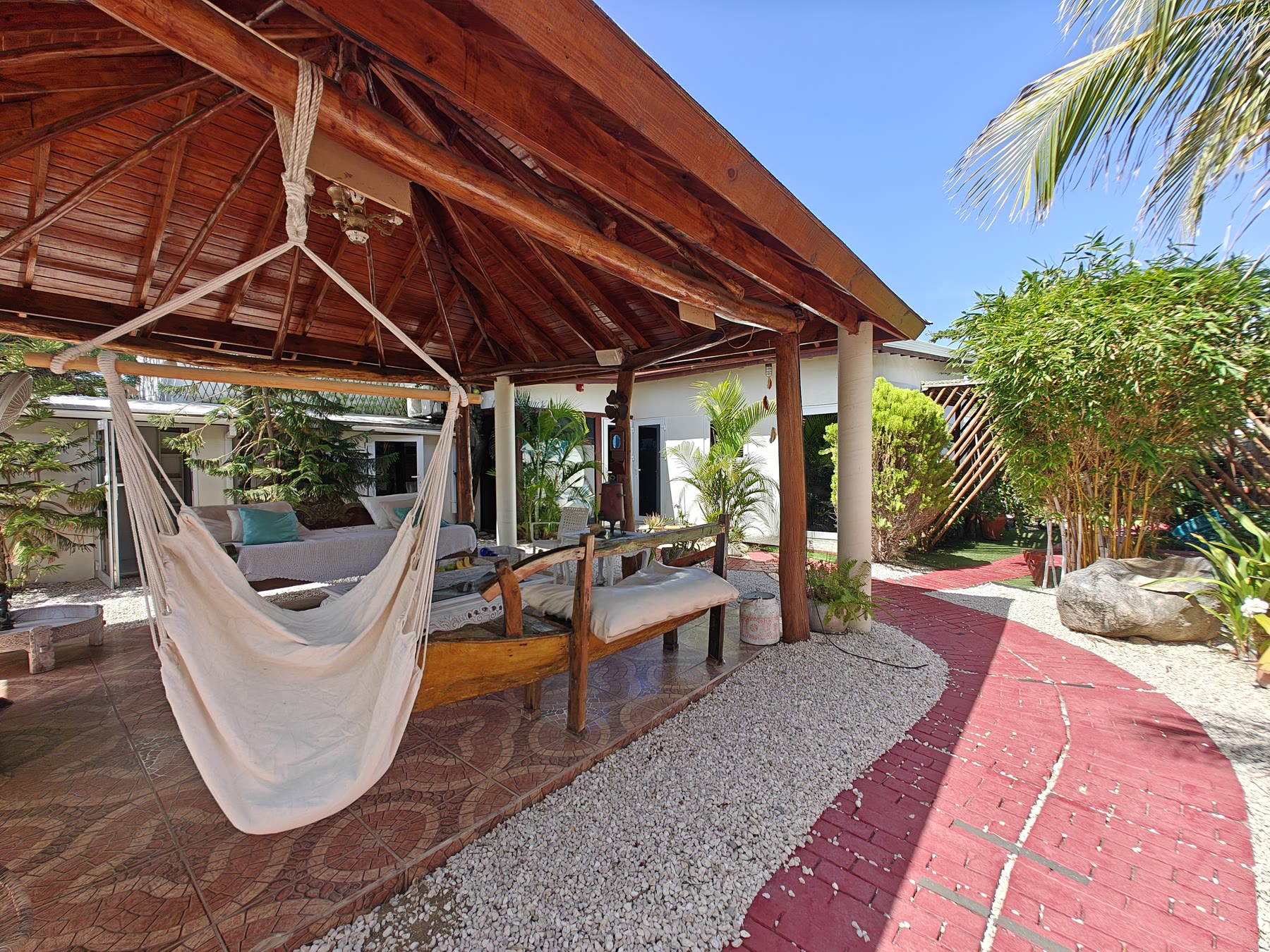 The gazebo seating area surrounded by tropical planting