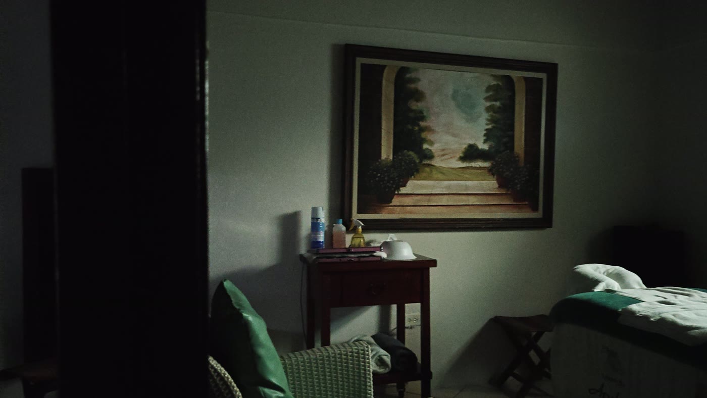 Treatment room two, with soft daylight falling through the window across the massage table